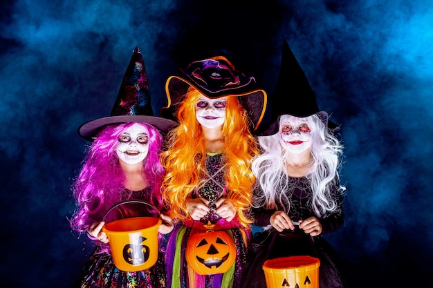 Three Beautiful girl in a witch costume