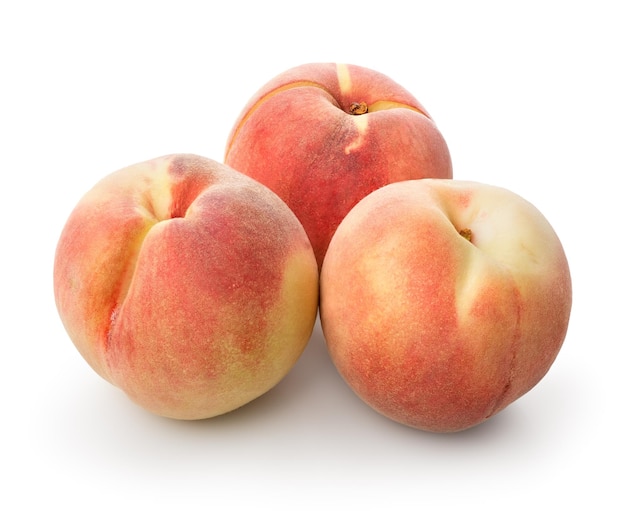 Three beautiful peaches isolated on a white background