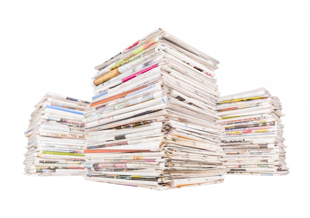 Photo three big stacks of newspapers