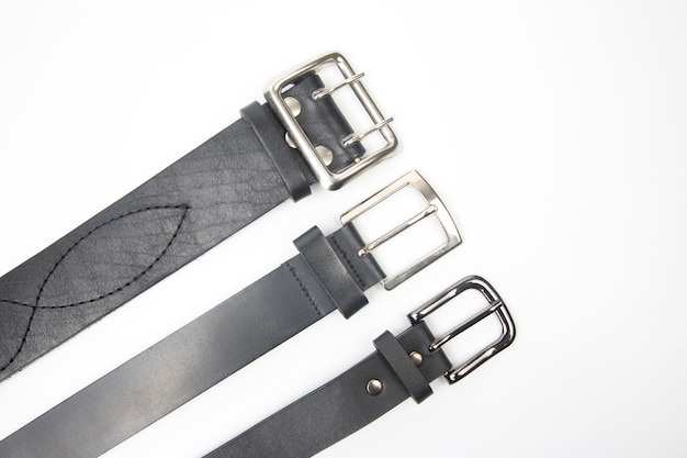 Photo three black leather belt on white