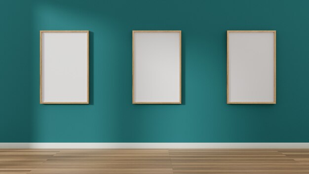 Three blank picture and poster frames on the wall.