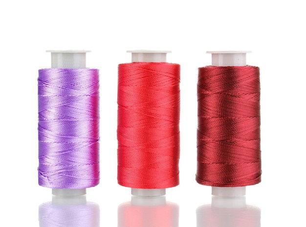 Three bobbin thread isolated on white