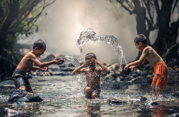 Three boy joyful with splashing