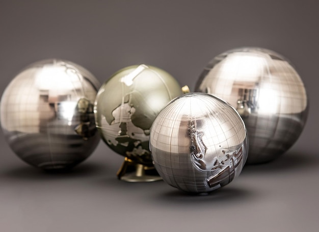 Three brushed metal globes