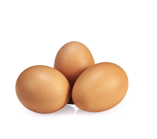 Three chicken eggs Isolated on white Background