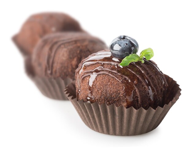 Three chocolate cakes isolated on a white background