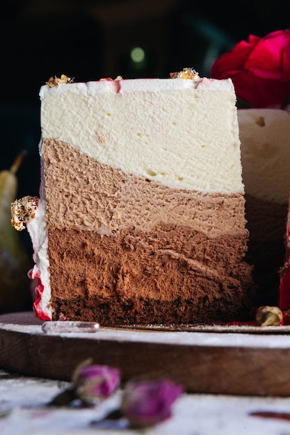 Three chocolates cake Layered cake with milk black and white chocolate souffle