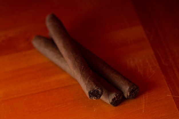 Three cigars on a table