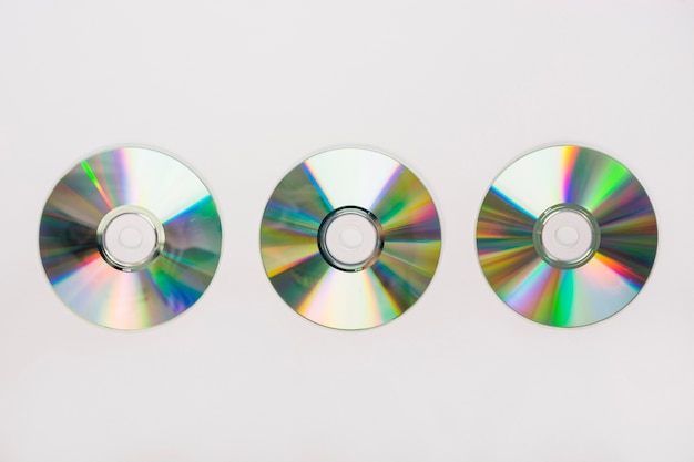 Three circular compact disc on white background