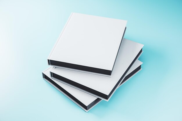 Three closed white hardcover book