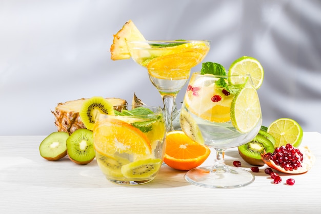 Three cocktails with fruit