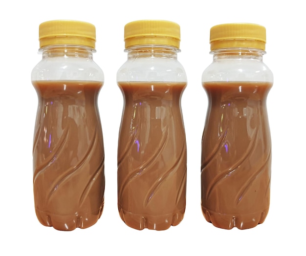 Three cold brew coffee latte in plastic bottles Isolated on white background Milk or creamy coffee