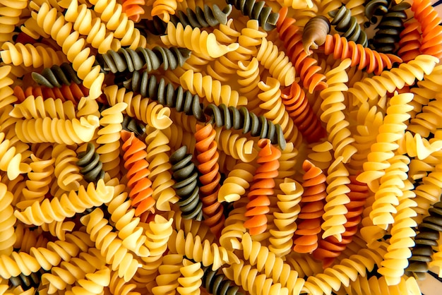 Three color screw noodles texture background.