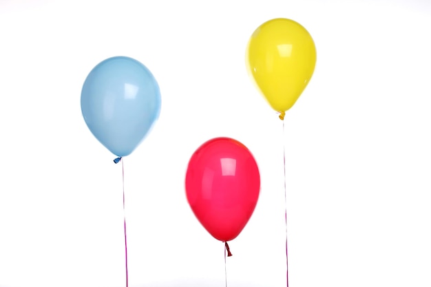 Three colored balloons isolated at white background