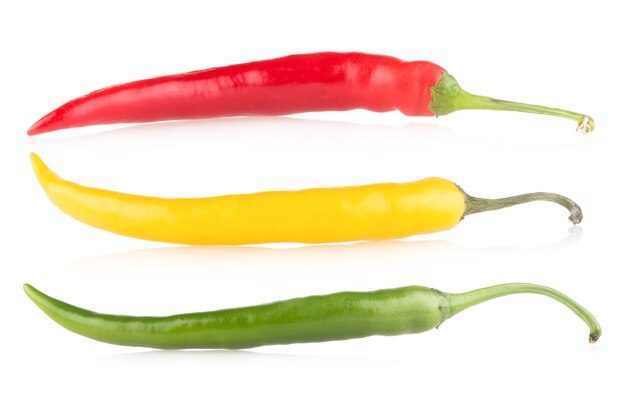 Three colorful chili peppers isolated on white background