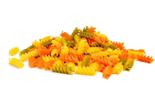 Three colors rotini pasta isolated on white.