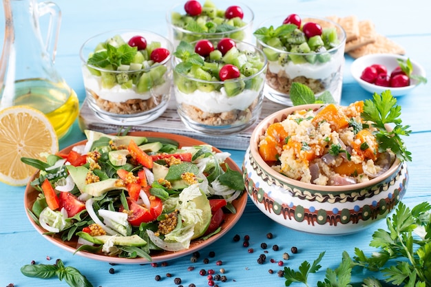 Three-course set menu for a nutritious healthy lunch. Three course set on a table in a business lunch, food set lunch. Full set of three dishes for lunch in a cafe