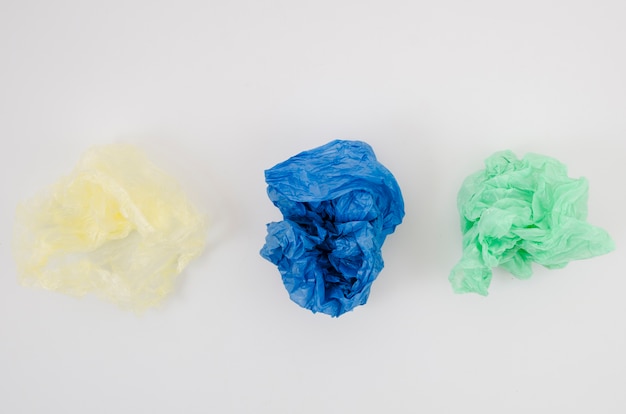 Three crumpled plastic bag in a row isolated on white background