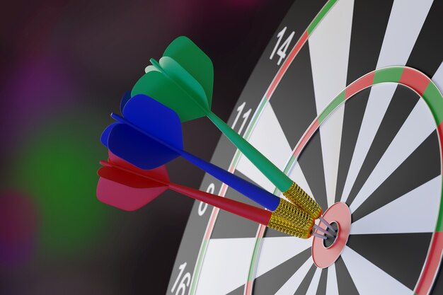 Three darts, blue, red and green, stuck in the center of a target