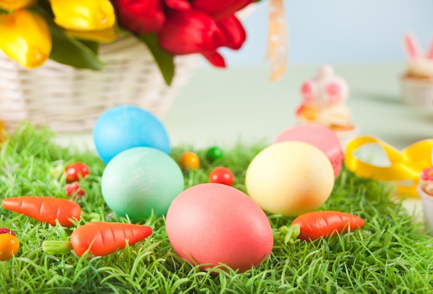 Three decorated easter eggs in the grass