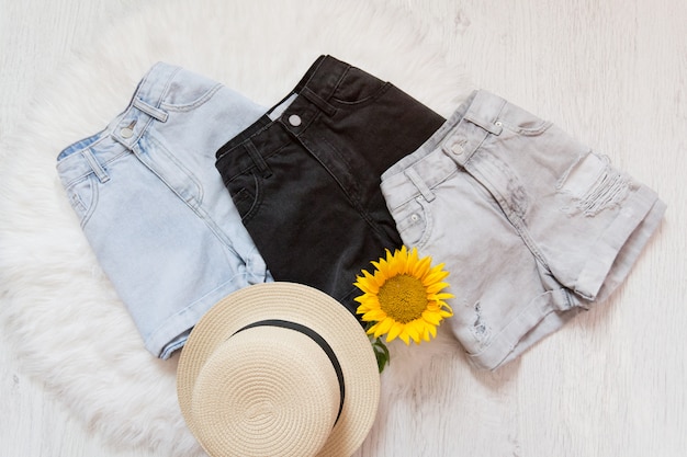 Three denim shorts, straw hat, shorts. 