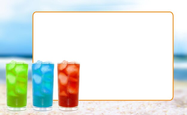 Photo three different colored drinks are next to a board that says quot ice quot