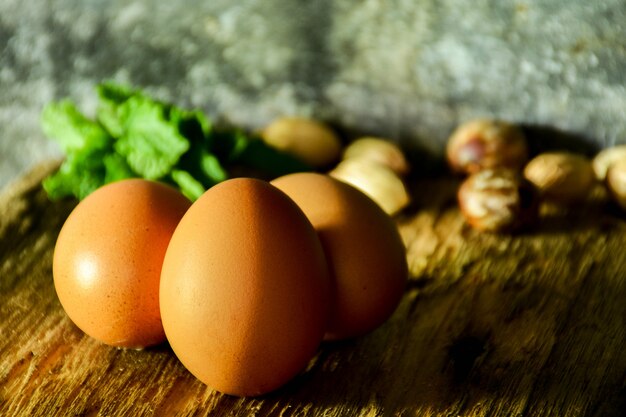 Photo three egg on chopping board in kitchen room