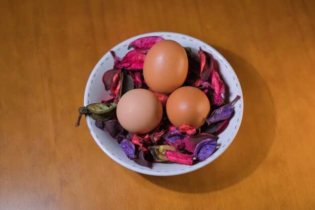 Three eggs in a bowl on a table