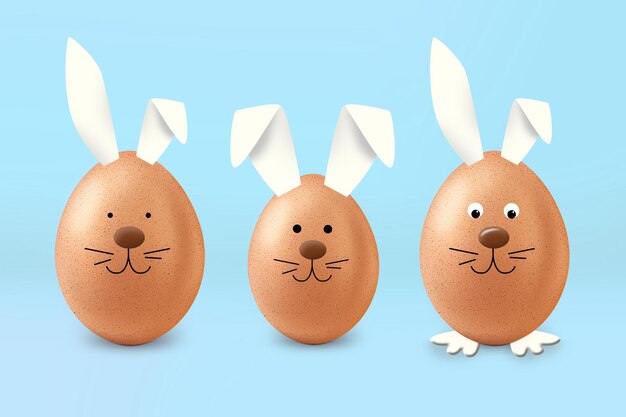 Foto tre uova con orecchie da coniglio e una con sopra un coniglietto.
