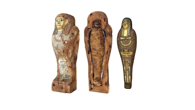 Three egyptian statues, one of which is a mummy.