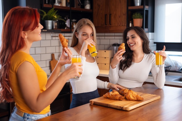 Three Female Friends Enjoying Breakfast At Home Together