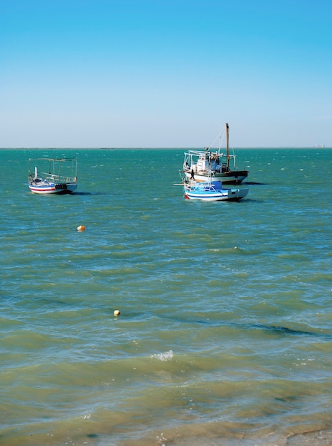 Three fishing boats in the Mediterranean Sea in Tunisia.