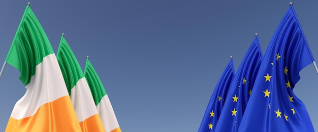 Three flags of the European Union and Ireland on flagpoles on the sides Flags on a blue background Place for text EU Europe Dublin Clover Commonwealth 3D illustration