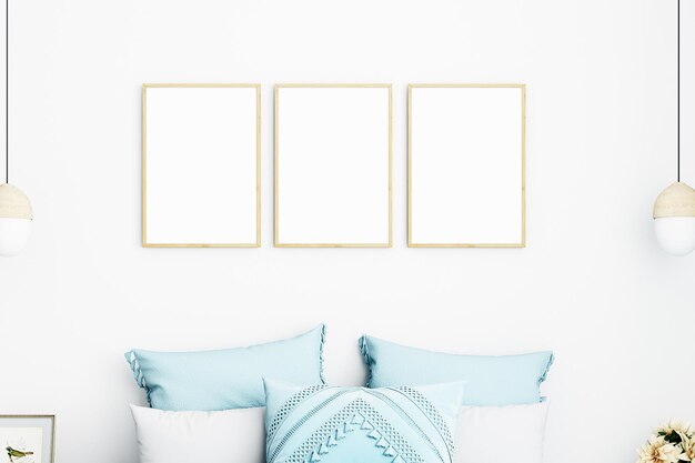 Three frames on a wall with blue pillows