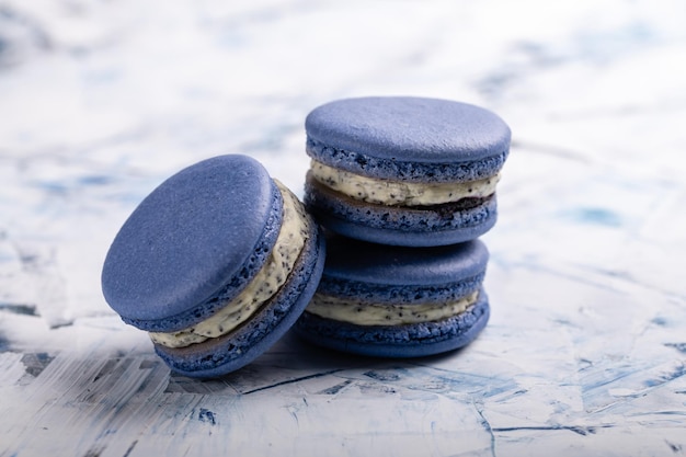 Three French macaroons of blue color