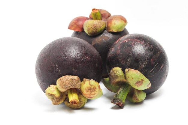 Three fresh organic mangosteen delicious fruit isolated on white background clipping path