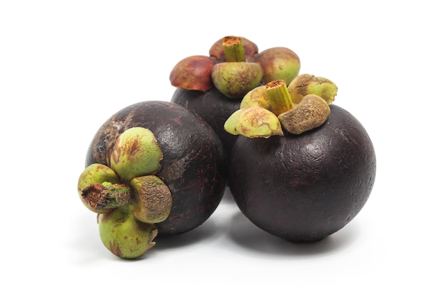 Three fresh organic mangosteen delicious fruit isolated on white background clipping path