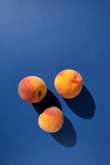 Three fresh peaches