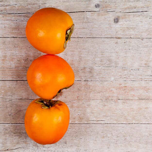 Three fresh persimmons 