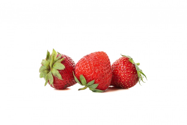 Three fresh strawberries isolated