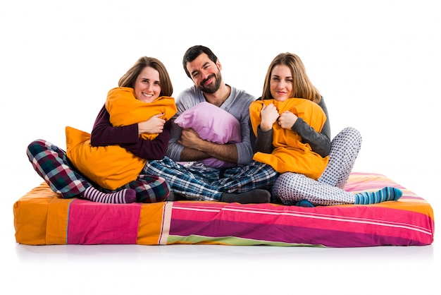 Three friends on a bed