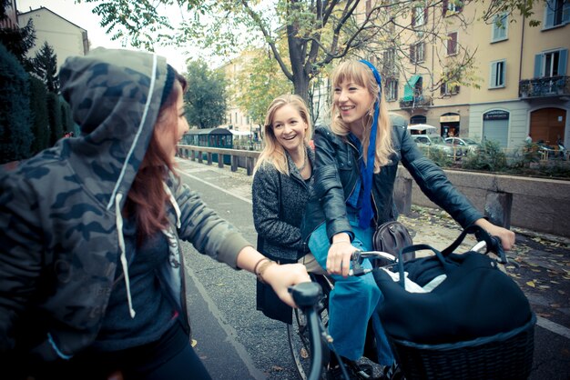 three friends woman on bike