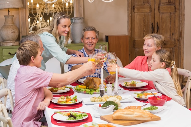 Photo three generation family enjoying christmas dinner together