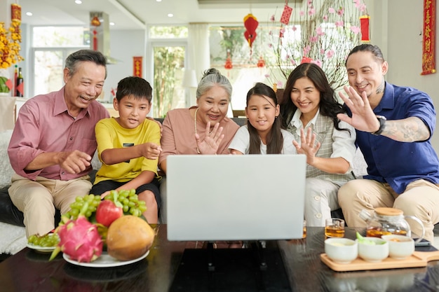 Three generation family making video call on chinese new year