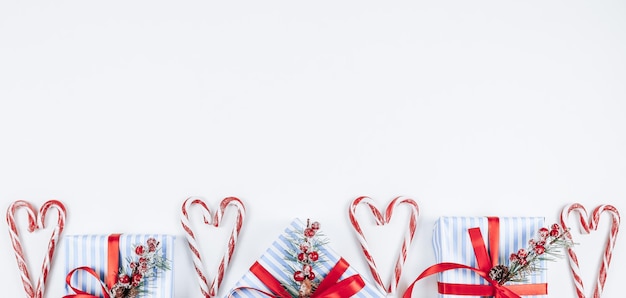 Three gifts with sweets on a white background