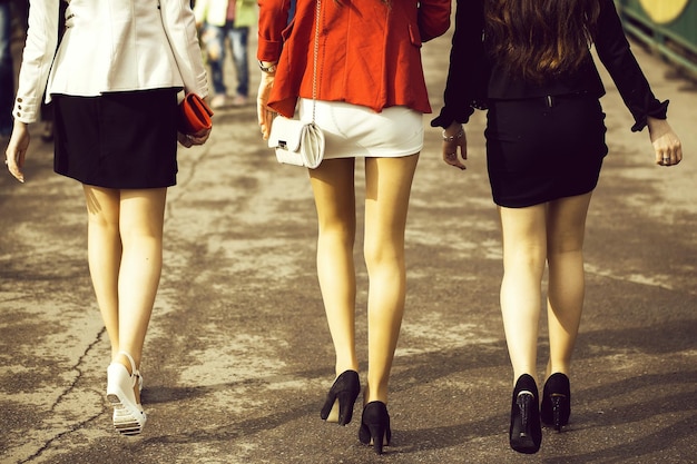 Three girls in short skirts