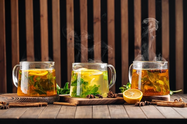 Photo three glass pots of various hot tea