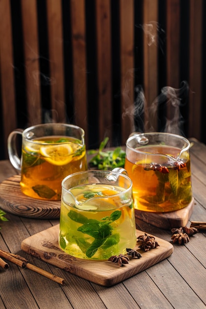 Three glass pots of various hot tea