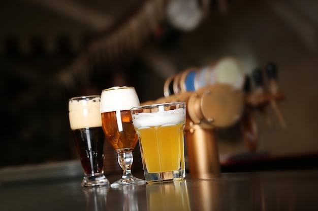 Three glasses of beer in a bar