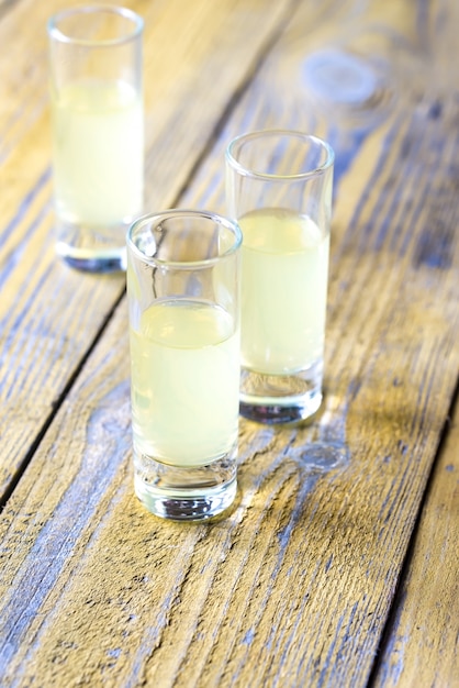 Photo three glasses of limoncello